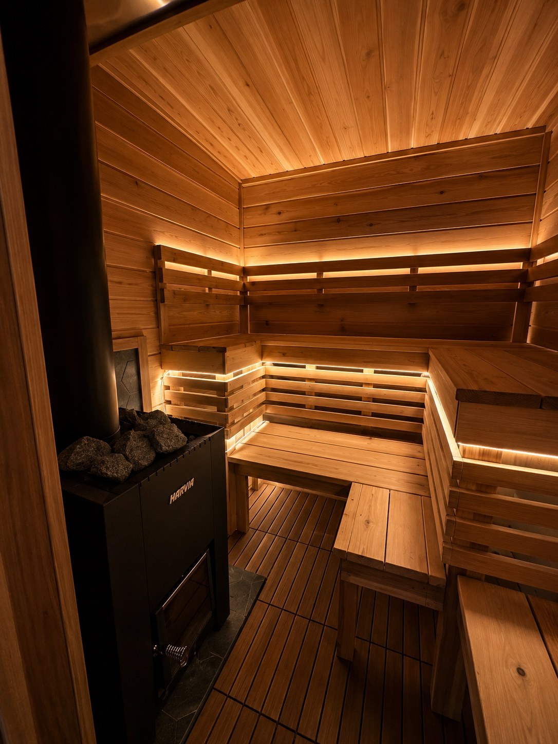 Wood-fired sauna interior with warm lighting